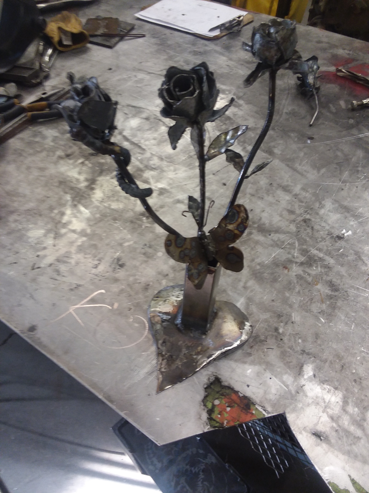 Butterfly Among Three Roses